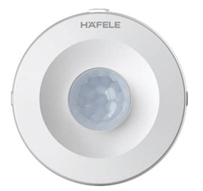 A white circular object with a light on it

AI-generated content may be incorrect.